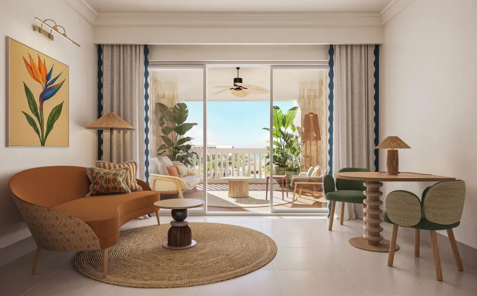 Ocean-front suite sitting area and balcony at JOIA Rose Hall by Iberostar.
