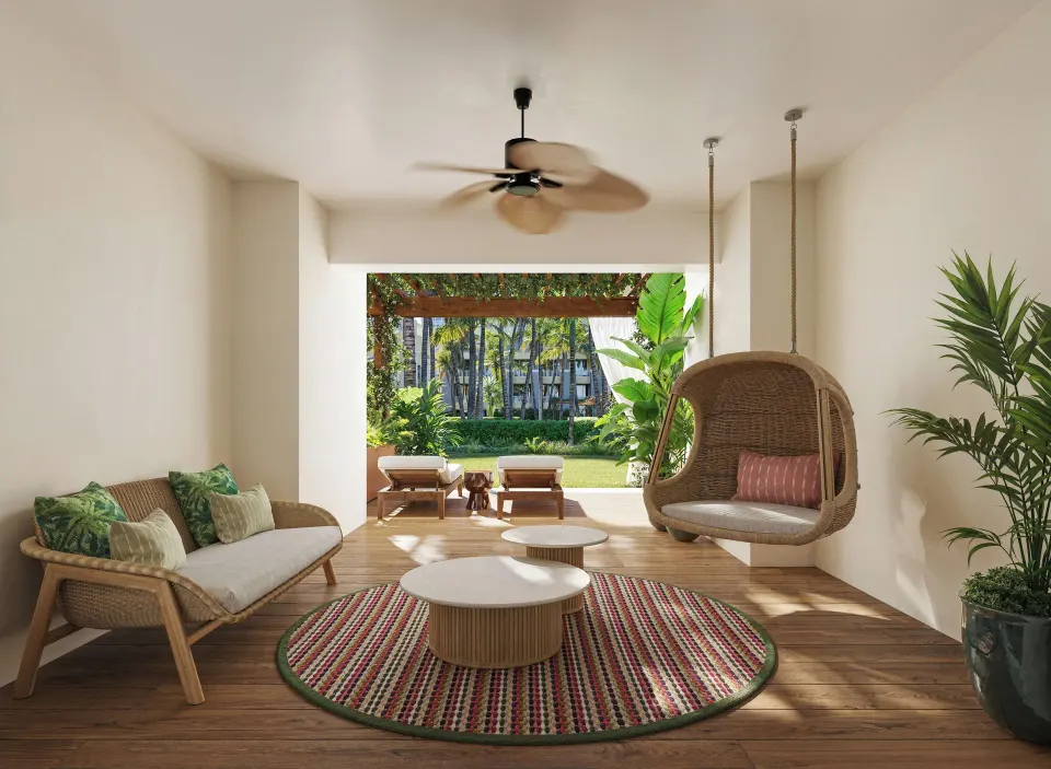 Private garden terrace with wicker seating for a Pool View Suite at JOIA Rose Hall by Iberostar.