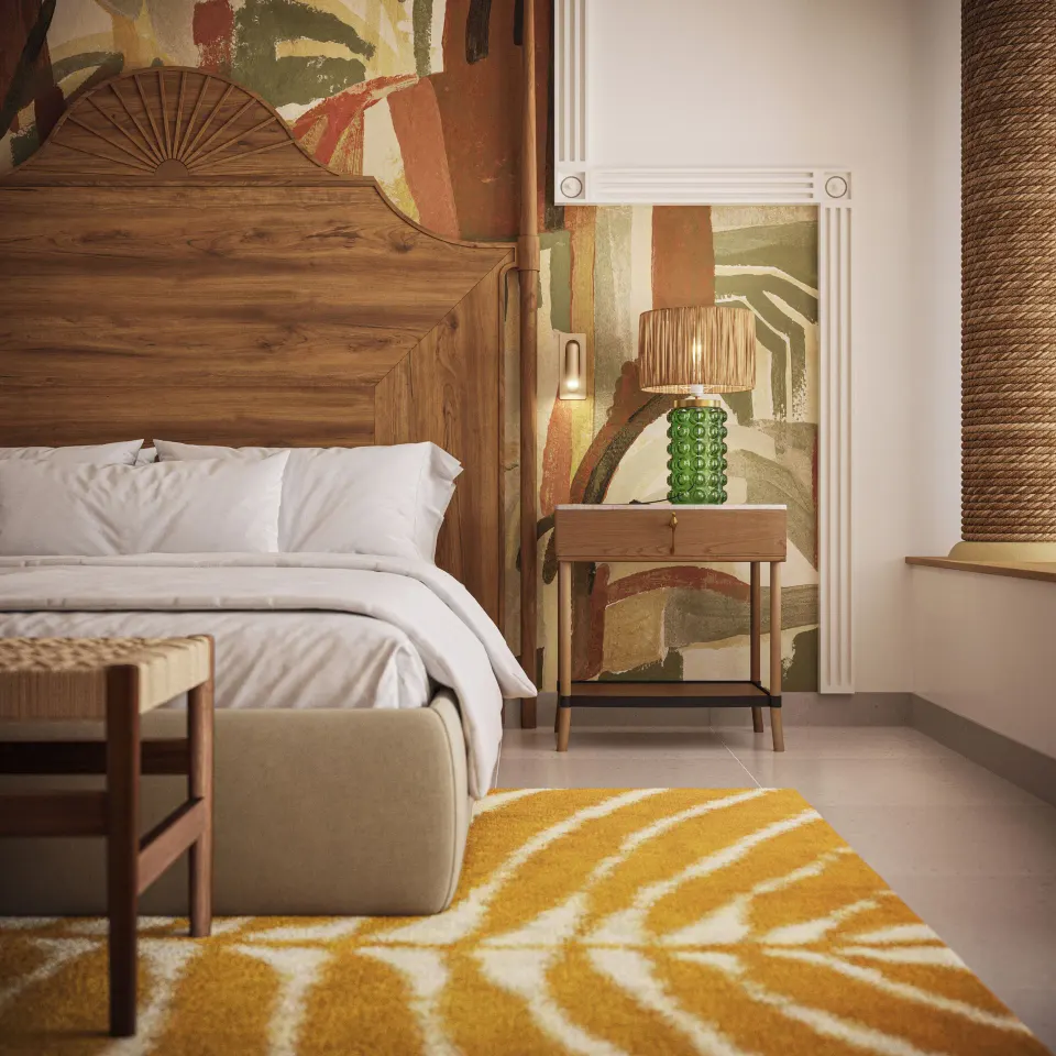 Suite king bed detail with wood headboard at JOIA Rose Hall by Iberostar.