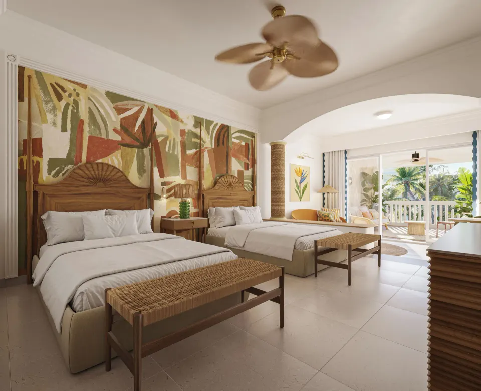 Two-bed suite with balcony seating at JOIA Rose Hall by Iberostar.