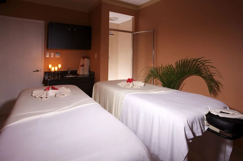 Spa treatment room with two massage tables at Jolly Beach Antigua.