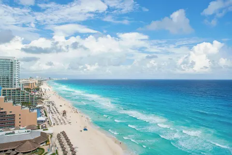Aerial view of Cancun beach and turquoise ocean by JW Marriott Cancun Resort & Spa.