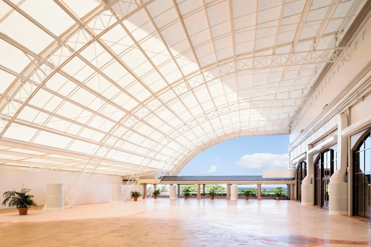 Sunlit covered terrace with arched roof at JW Marriott Cancun Resort & Spa.