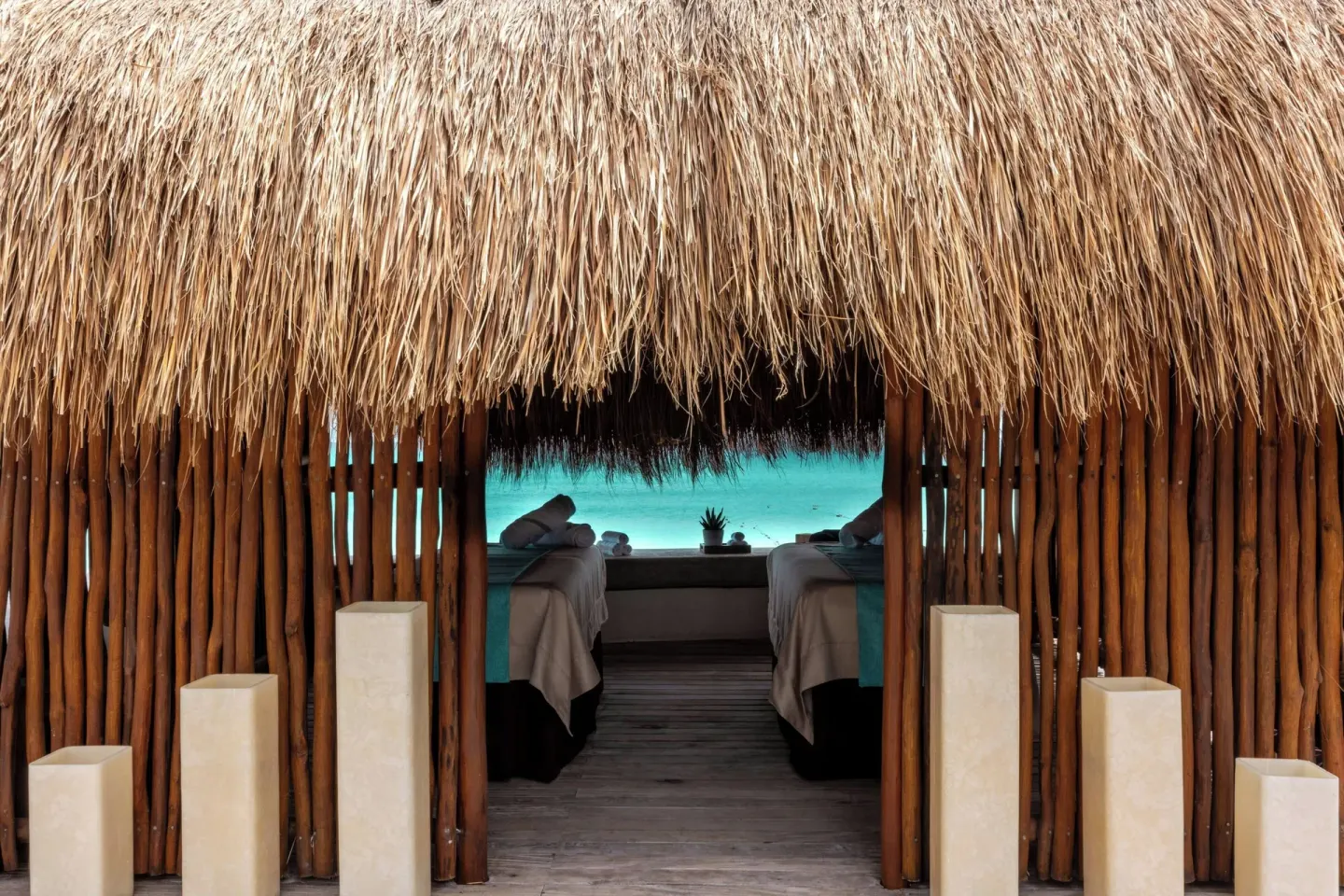 Entrance to a thatched beachfront spa cabana at JW Marriott Cancun Resort & Spa.
