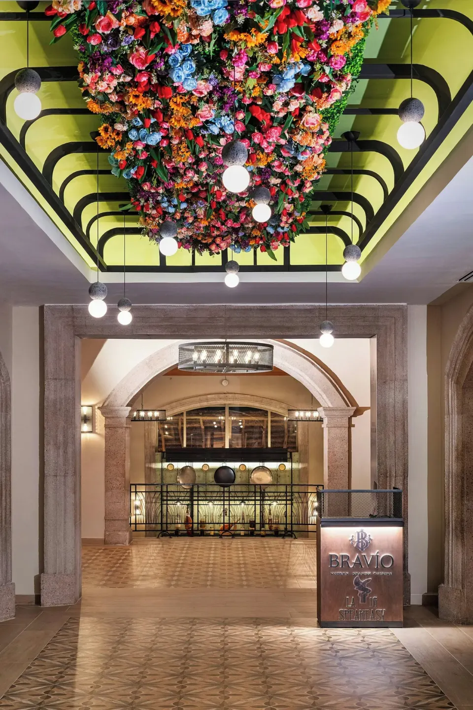 Bravio entrance with floral ceiling installation at JW Marriott Cancun Resort & Spa.