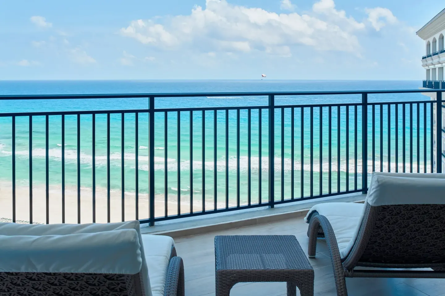 Presidential Suite balcony with ocean-facing lounge chairs at JW Marriott Cancun Resort & Spa.