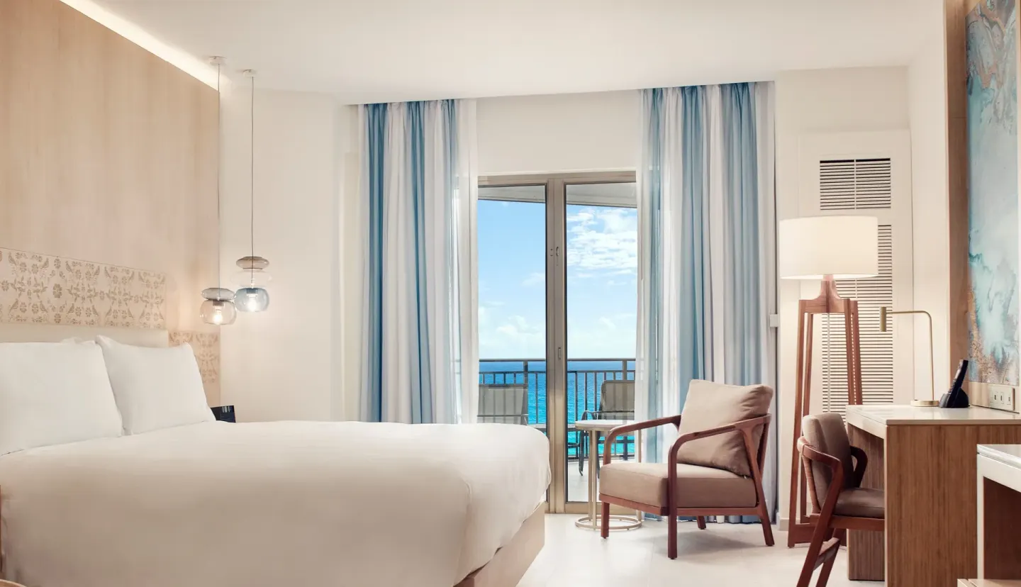 King guest room with balcony ocean view at JW Marriott Cancun Resort & Spa.