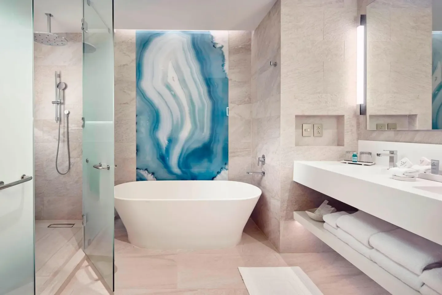 Deluxe Room Ocean View bathroom with tub and shower at JW Marriott Cancun Resort & Spa.