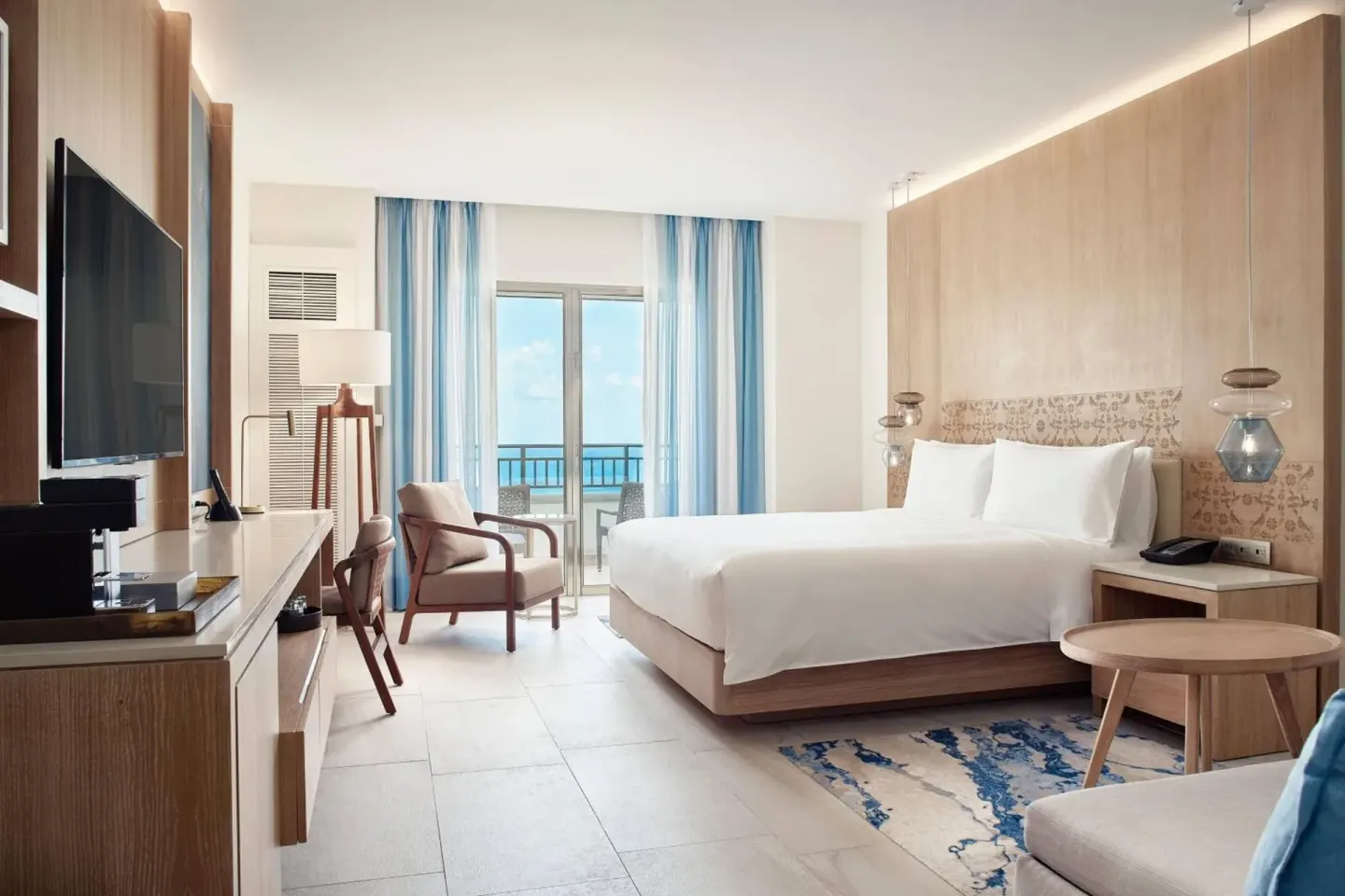 Deluxe Room Ocean View with king bed and balcony at JW Marriott Cancun Resort & Spa.