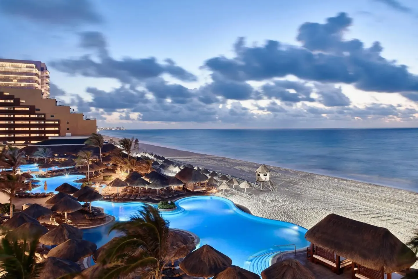 Evening ocean view over pools and beach from JW Marriott Cancun Resort & Spa.