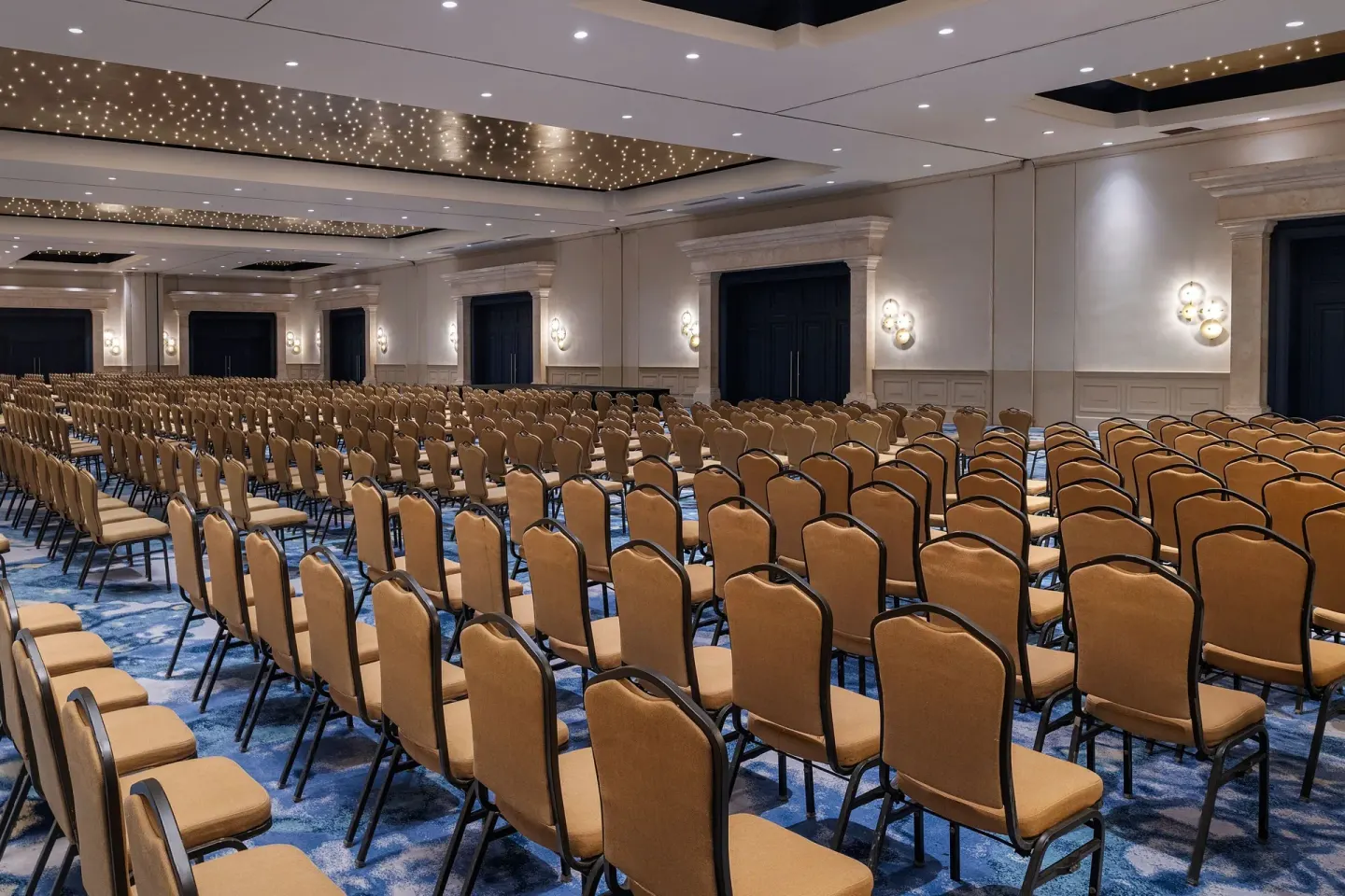 Large ballroom set with rows of chairs for a meeting at JW Marriott Cancun Resort & Spa.