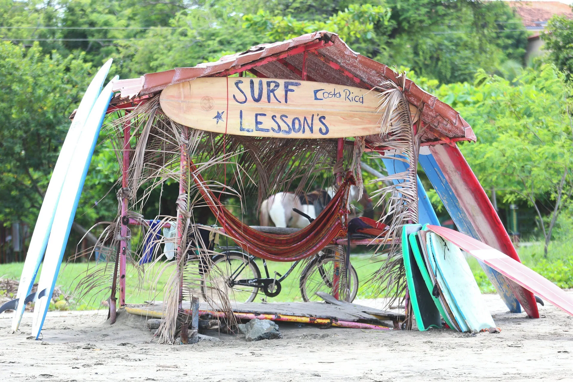 Surf lesson hut with boards on the beach at JW Marriott Guanacaste Resort and Spa.
