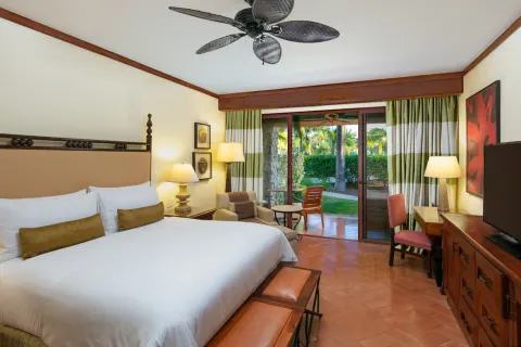 King guest room at JW Marriott Guanacaste Resort and Spa with a terrace opening to tropical gardens.