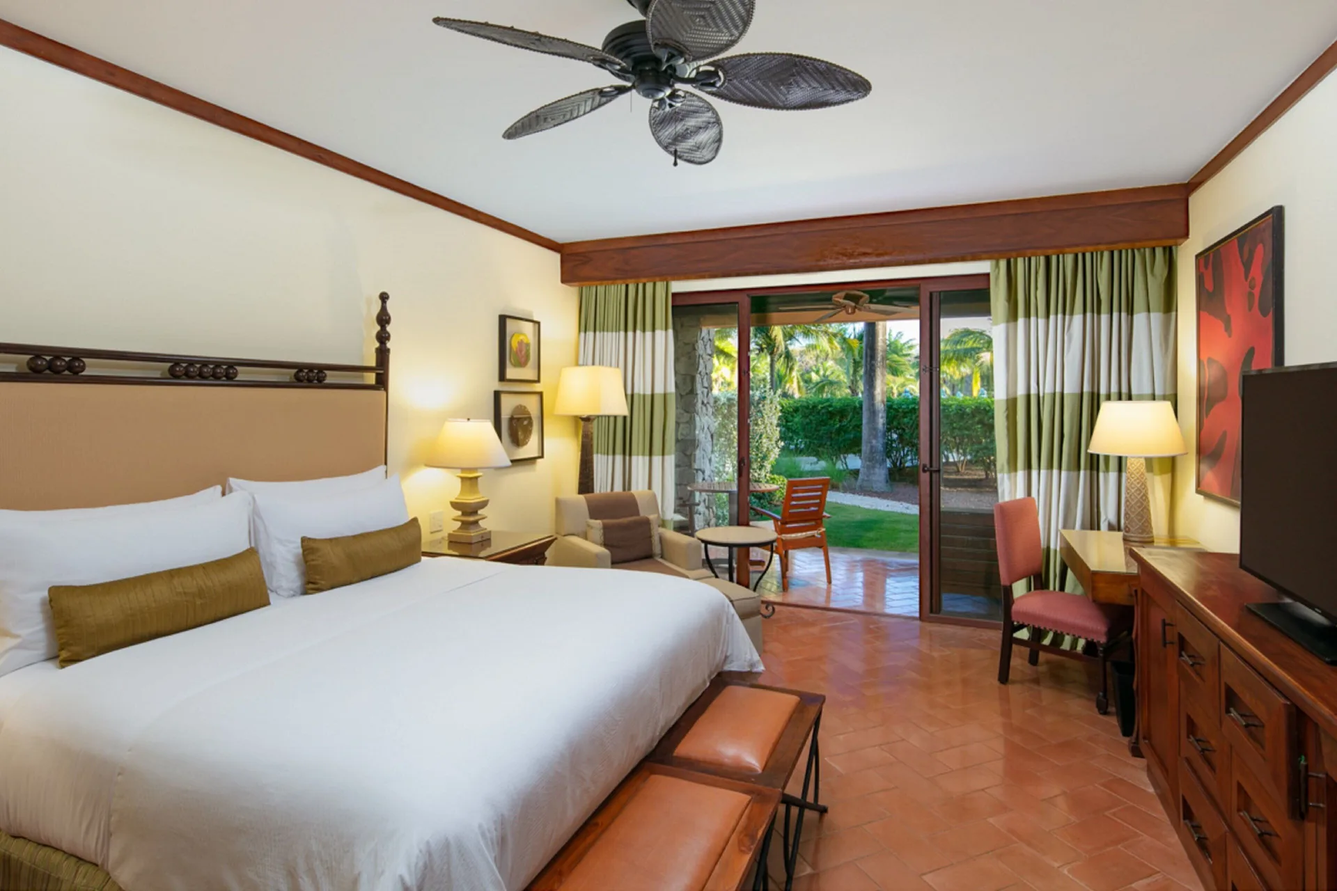 King guest room at JW Marriott Guanacaste Resort and Spa with a terrace opening to tropical gardens.