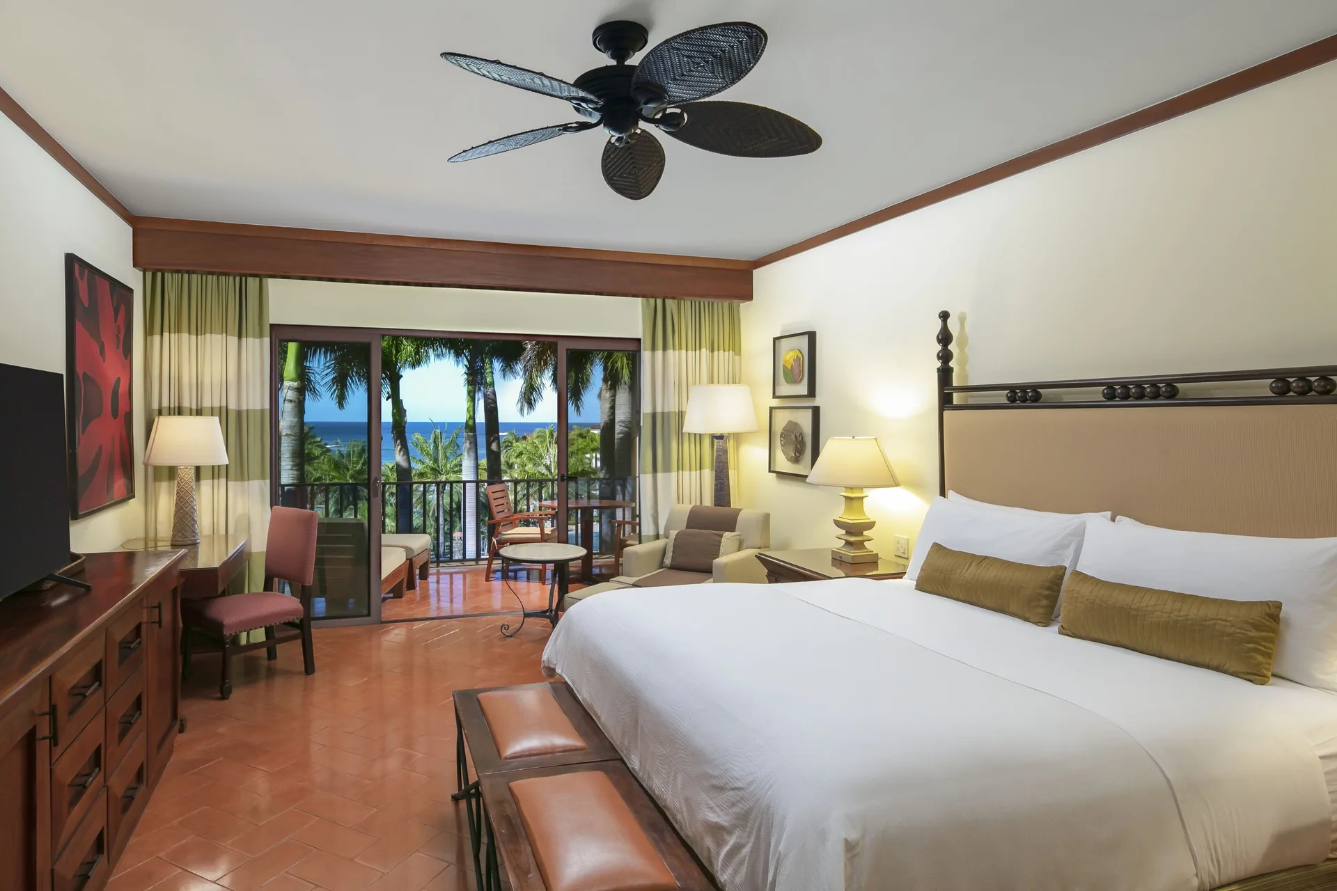 King bed guest room with ocean-facing balcony at JW Marriott Guanacaste Resort and Spa.