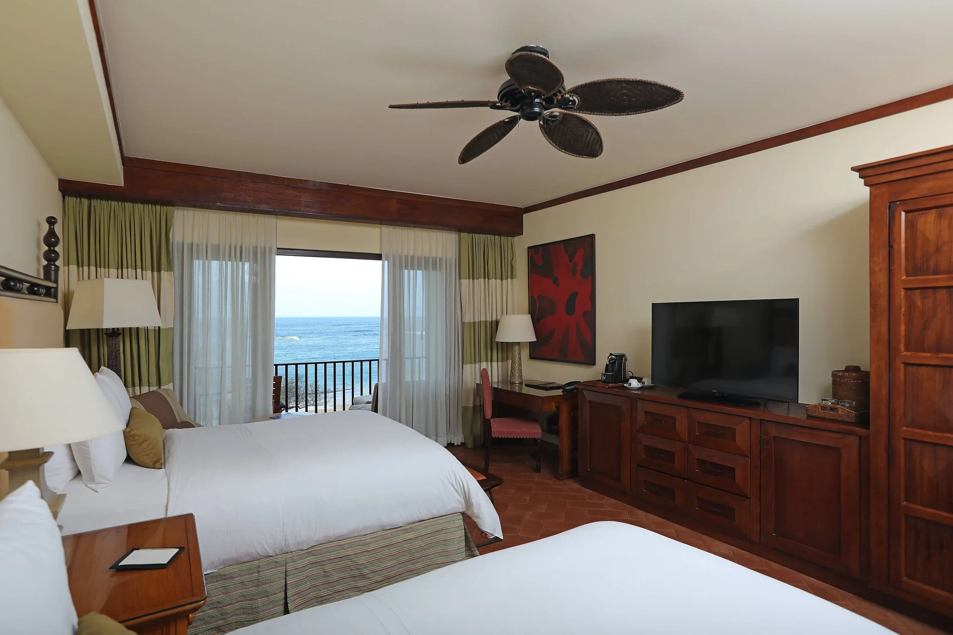Guest room with two beds and balcony ocean view at JW Marriott Guanacaste Resort and Spa.