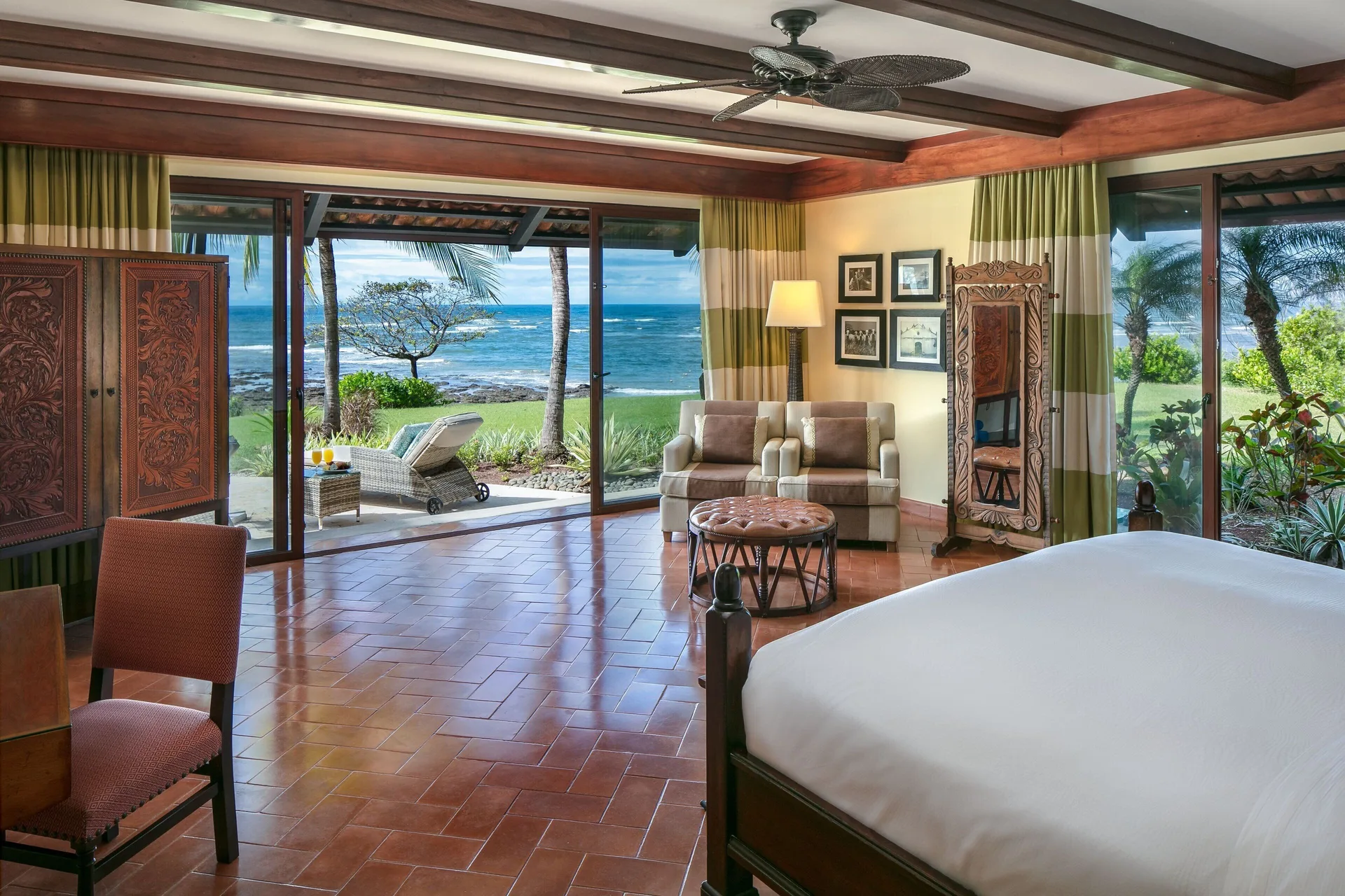 Oceanfront king suite at JW Marriott Guanacaste Resort and Spa with seating area and patio views of the water.
