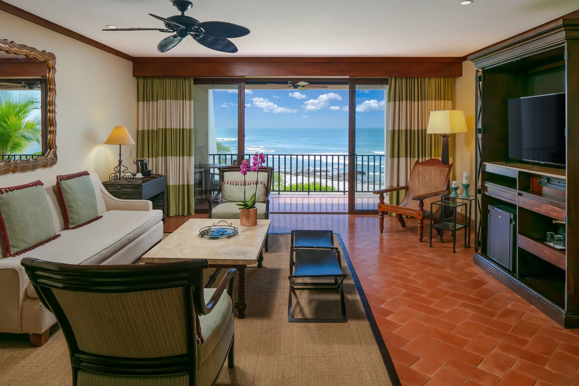 Oceanfront suite living room with balcony at JW Marriott Guanacaste Resort and Spa.