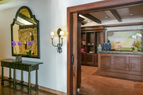 Reception desk and orchid display at JW Marriott Guanacaste Resort and Spa.