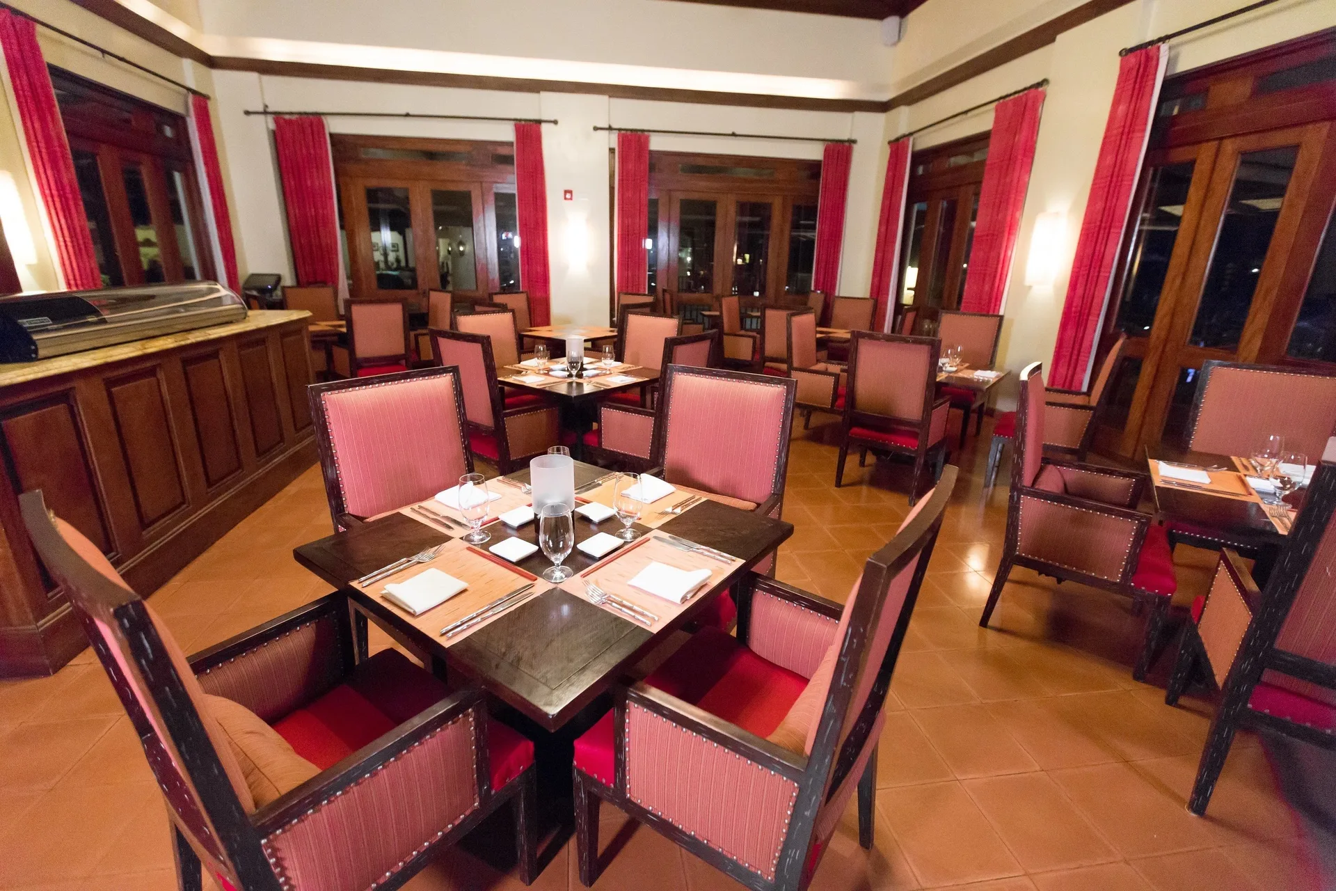 Set dining room with red chairs at JW Marriott Guanacaste Resort and Spa.