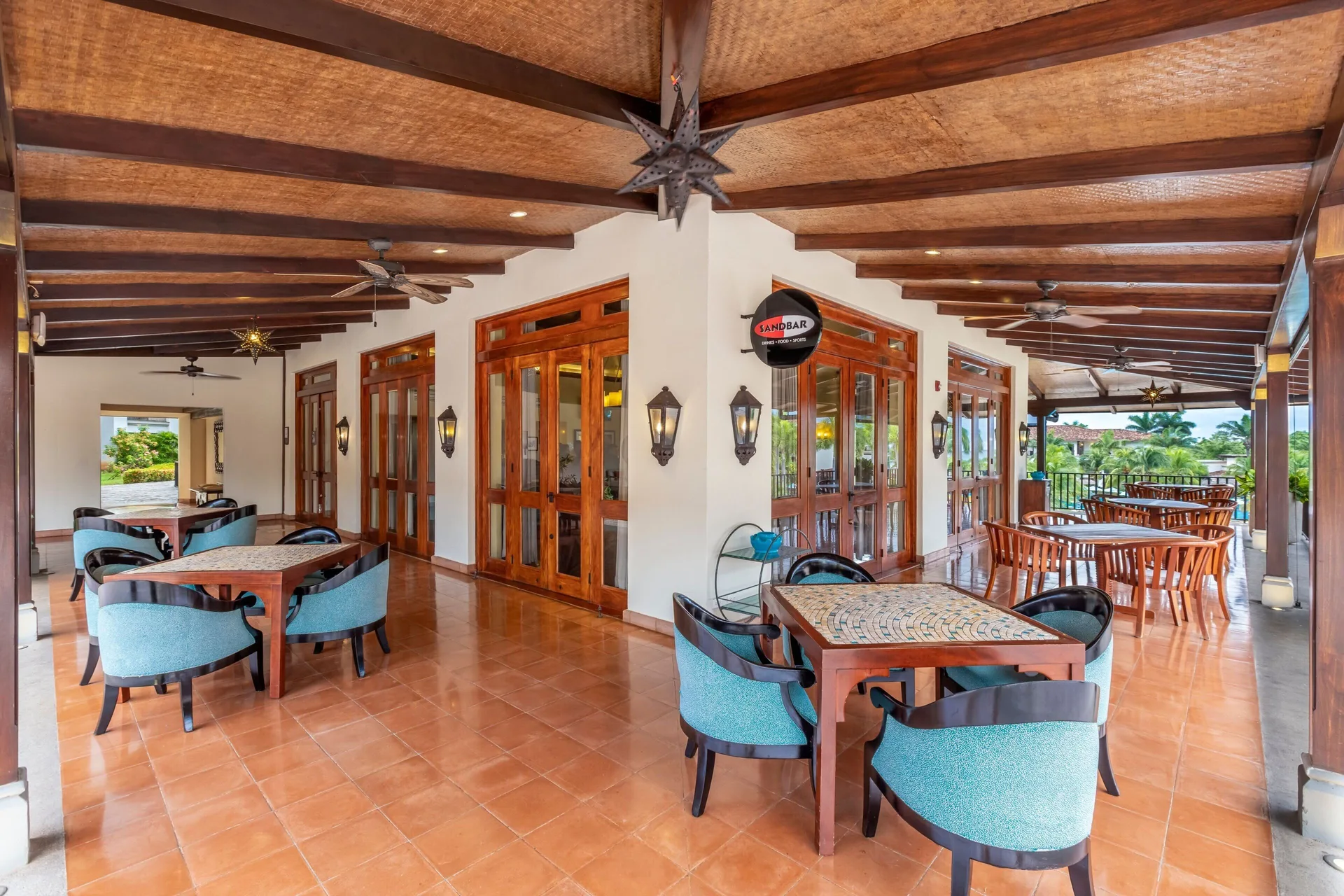 Covered Sandbar Lounge patio seating at JW Marriott Guanacaste Resort and Spa.
