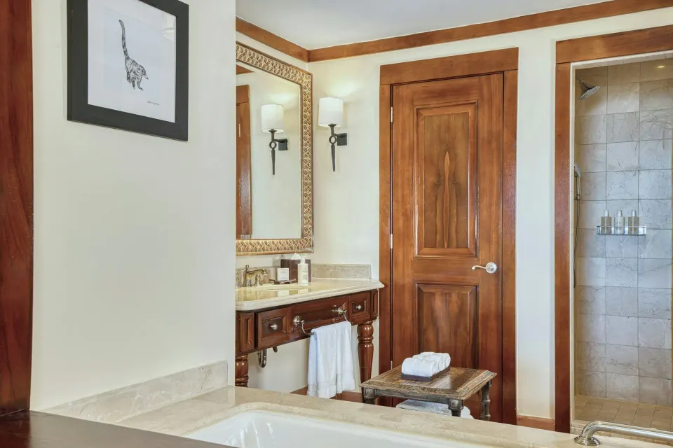 Deluxe Room bath with vanity, tub, and shower at JW Marriott Guanacaste Resort and Spa.