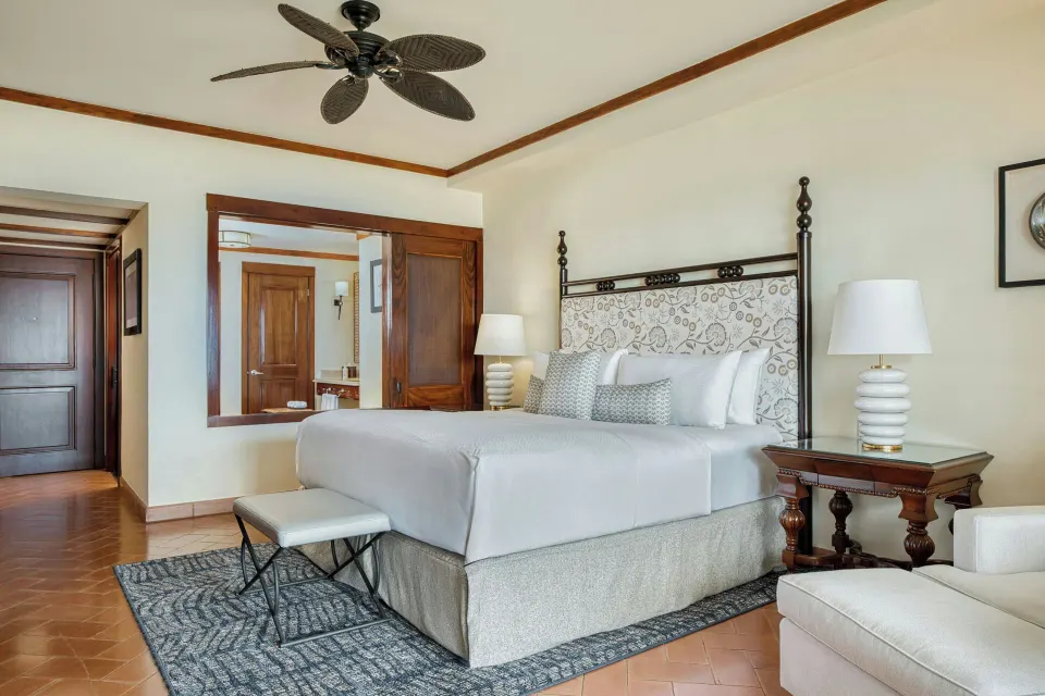 Deluxe Room king bed with wood accents at JW Marriott Guanacaste Resort and Spa.
