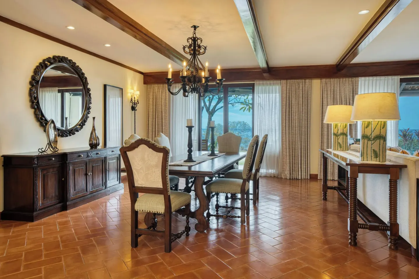 Presidential Suite dining room with ocean-view doors at JW Marriott Guanacaste Resort and Spa.