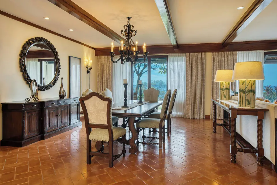 Presidential Suite dining room with ocean-view doors at JW Marriott Guanacaste Resort and Spa.