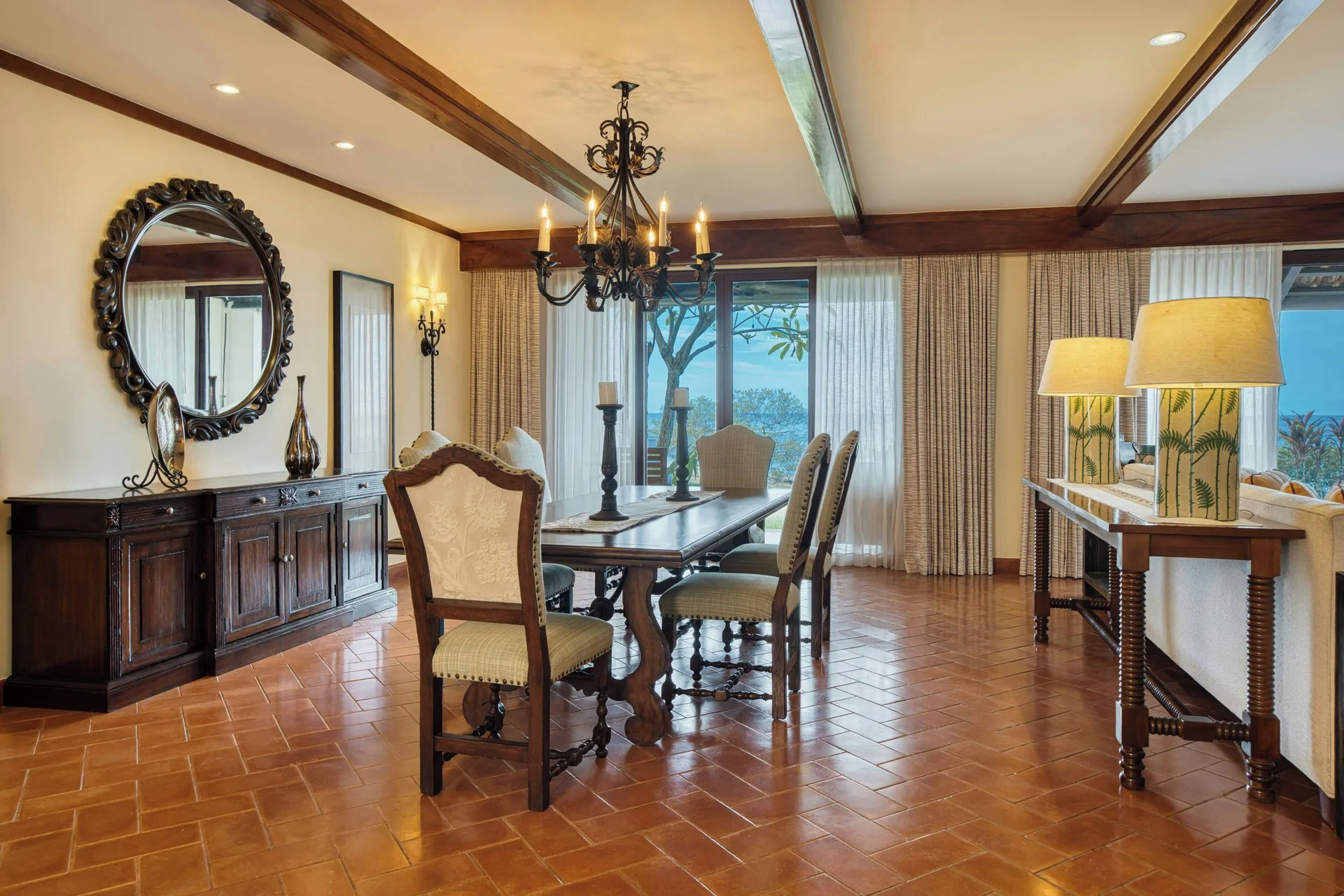 Presidential Suite dining room with ocean-view doors at JW Marriott Guanacaste Resort and Spa.