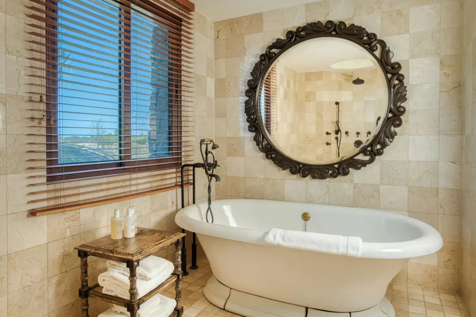 Suite bathroom tub with window and towels at JW Marriott Guanacaste Resort and Spa.