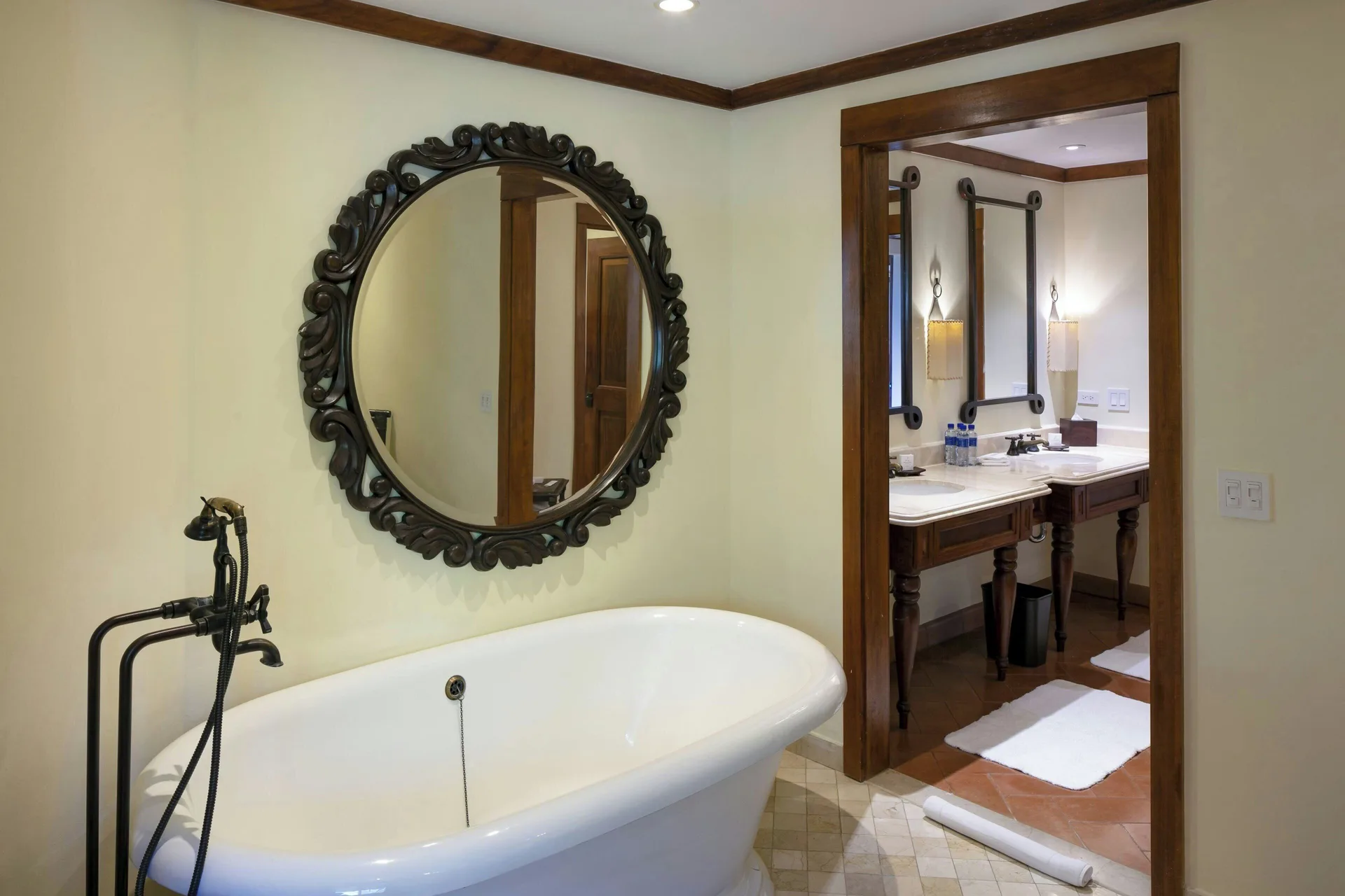 Suite bathroom soaking tub with round mirror at JW Marriott Guanacaste Resort and Spa.
