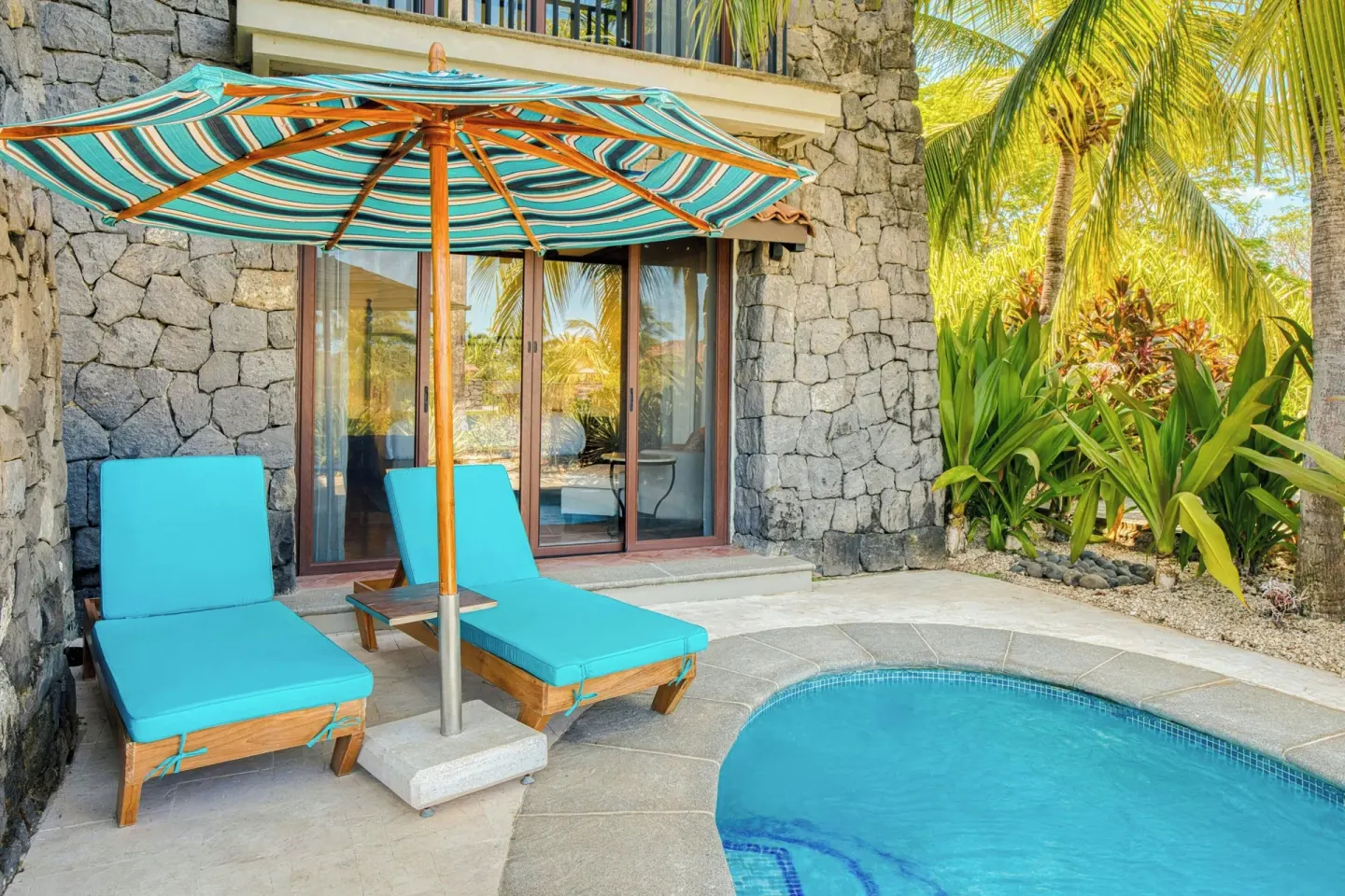 Suite terrace with plunge pool and turquoise loungers at JW Marriott Guanacaste Resort and Spa.