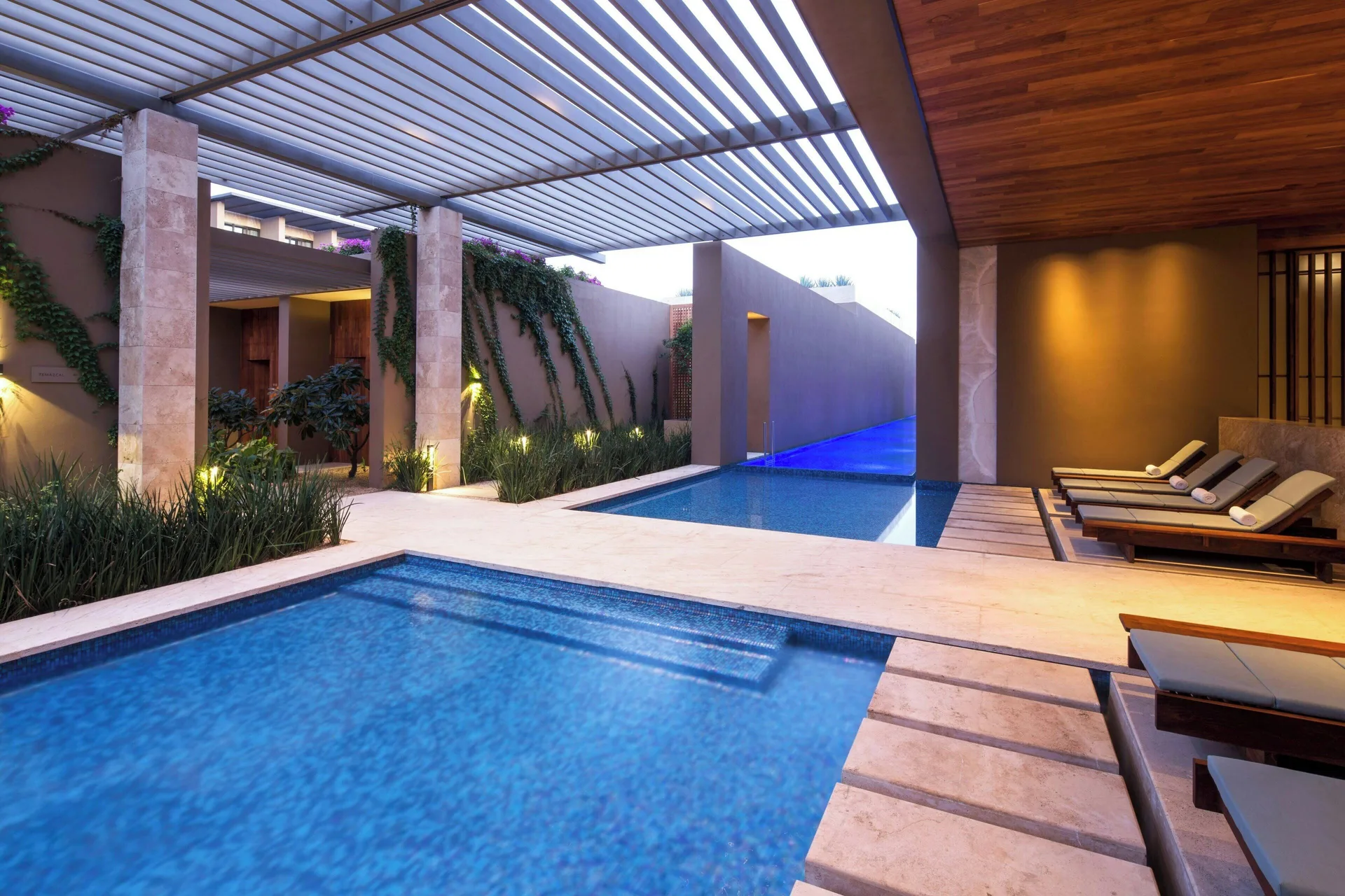 Covered spa pool courtyard with loungers at JW Marriott Los Cabos Beach Resort & Spa.