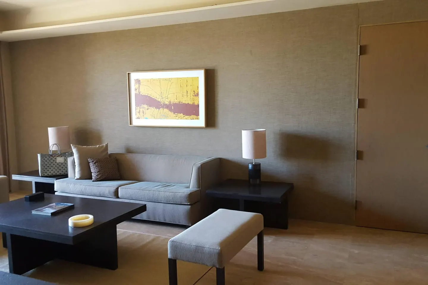 Guest room sitting area with sofa at JW Marriott Los Cabos Beach Resort & Spa.