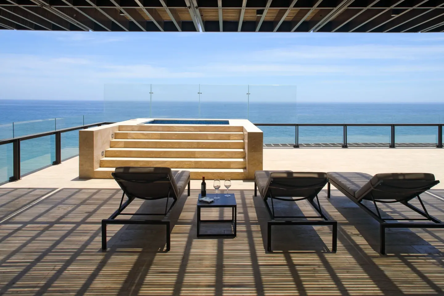 Oceanfront terrace with loungers and plunge pool at JW Marriott Los Cabos Beach Resort & Spa.
