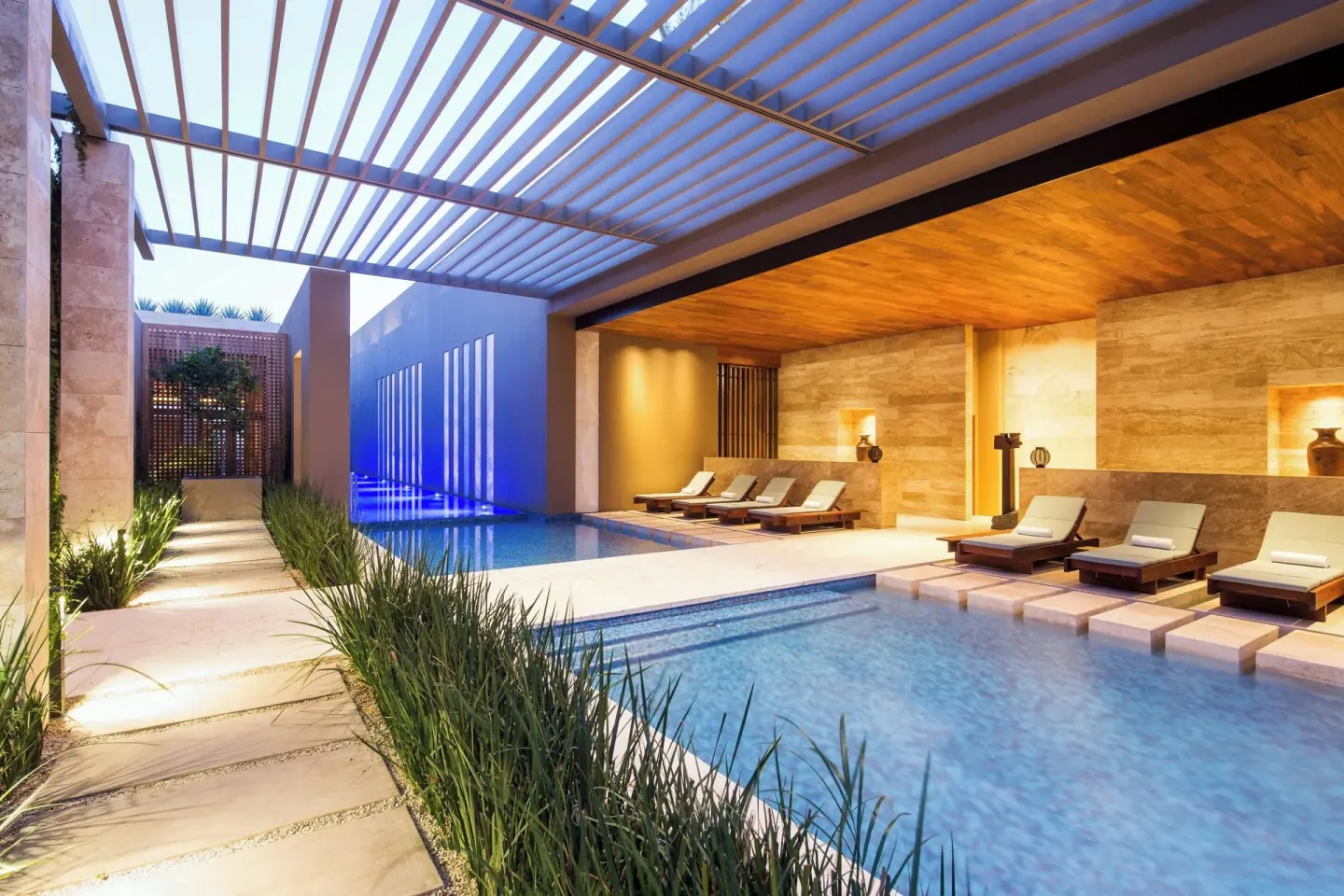 Spa pool with loungers and pergola at JW Marriott Los Cabos Beach Resort & Spa.