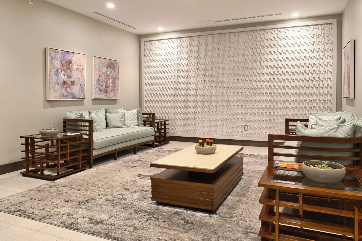 Lobby seating area with sofas and textured wall at JW Marriott St. Maarten Beach Resort & Spa.