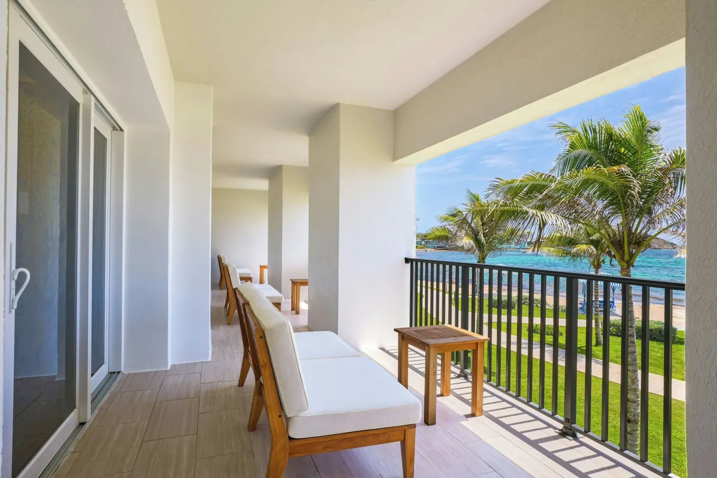 Ocean-facing balcony with loungers at JW Marriott St. Maarten Beach Resort & Spa.