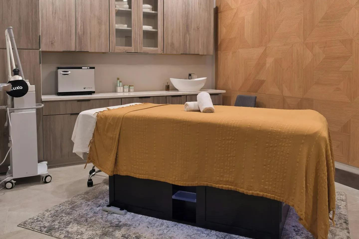 Single spa treatment table with mustard cover at JW Marriott St. Maarten Beach Resort & Spa.