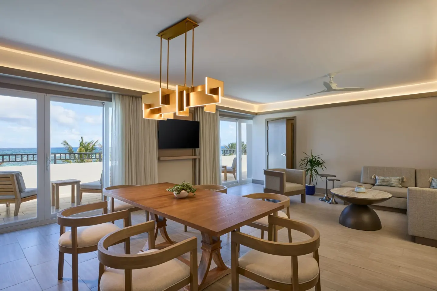 Suite dining and living room with oceanfront balcony at JW Marriott St. Maarten Beach Resort & Spa.