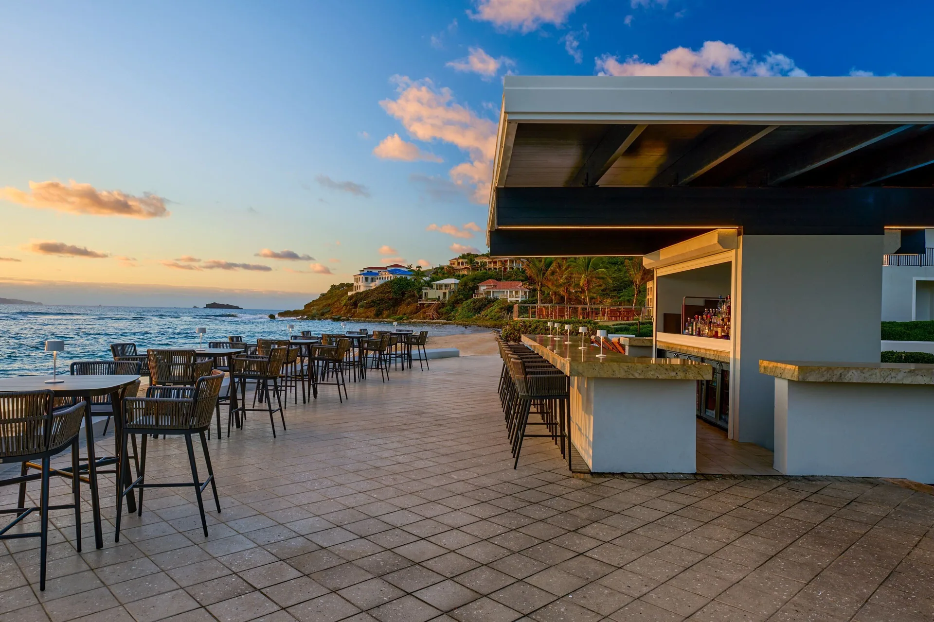 Beachfront bar terrace at sunset at JW Marriott St. Maarten Beach Resort & Spa.