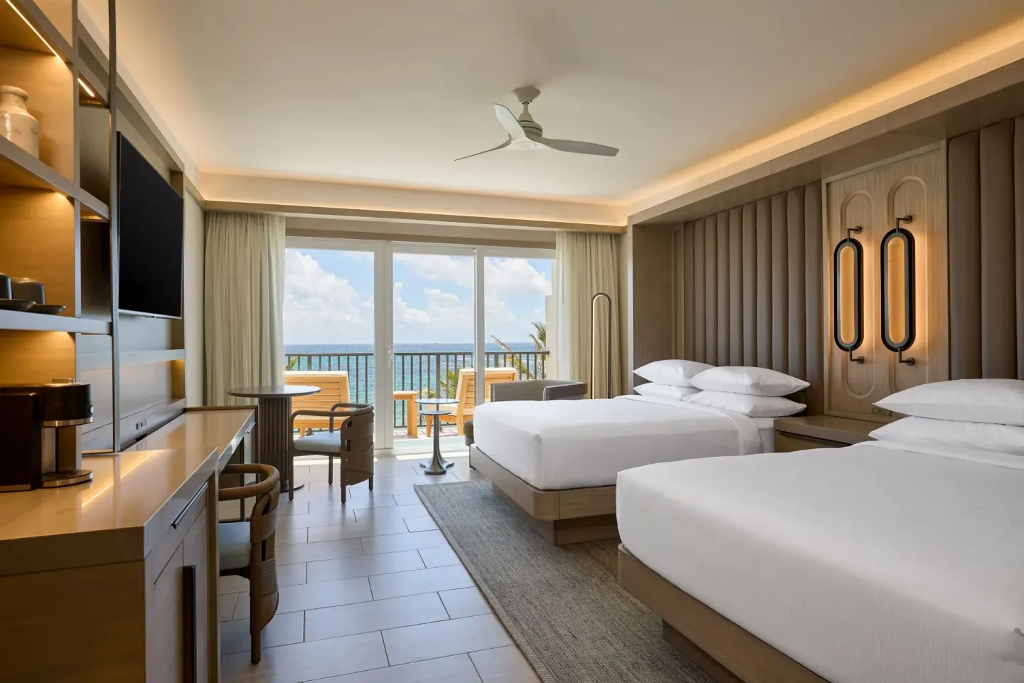 Deluxe oceanfront balcony room with two beds at JW Marriott St. Maarten Beach Resort & Spa.