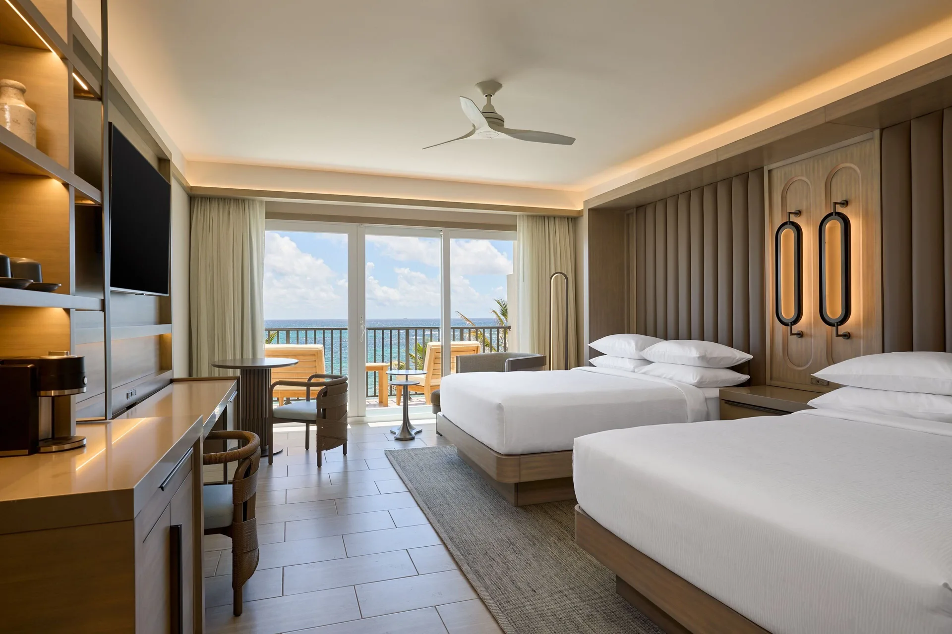 Deluxe oceanfront balcony room with two beds at JW Marriott St. Maarten Beach Resort & Spa.