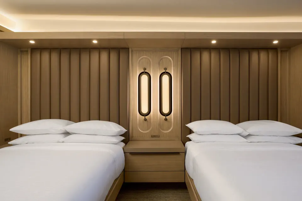 Two double beds with shared nightstand at JW Marriott St. Maarten Beach Resort & Spa.