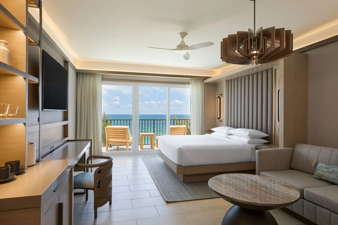 Deluxe oceanfront room with sofa bed and balcony at JW Marriott St. Maarten Beach Resort & Spa.