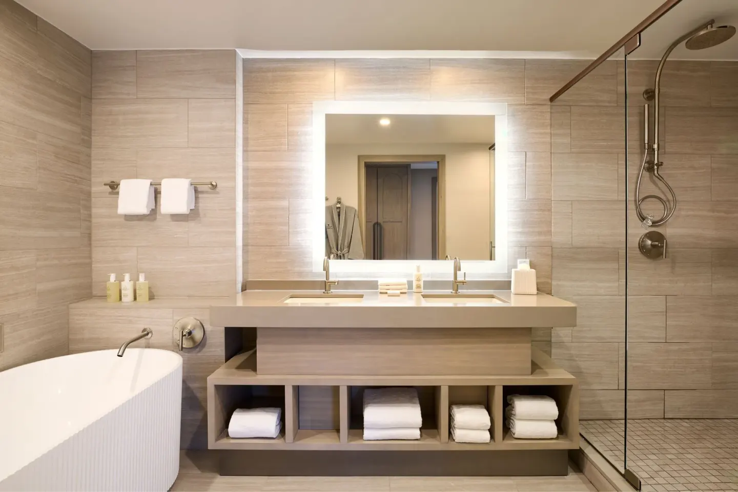 Deluxe room bathroom with tub, double vanity, and shower at JW Marriott St. Maarten Beach Resort & Spa.
