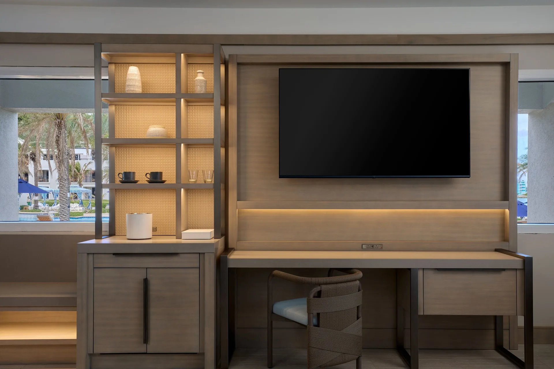 Deluxe room desk, shelving, and TV at JW Marriott St. Maarten Beach Resort & Spa.