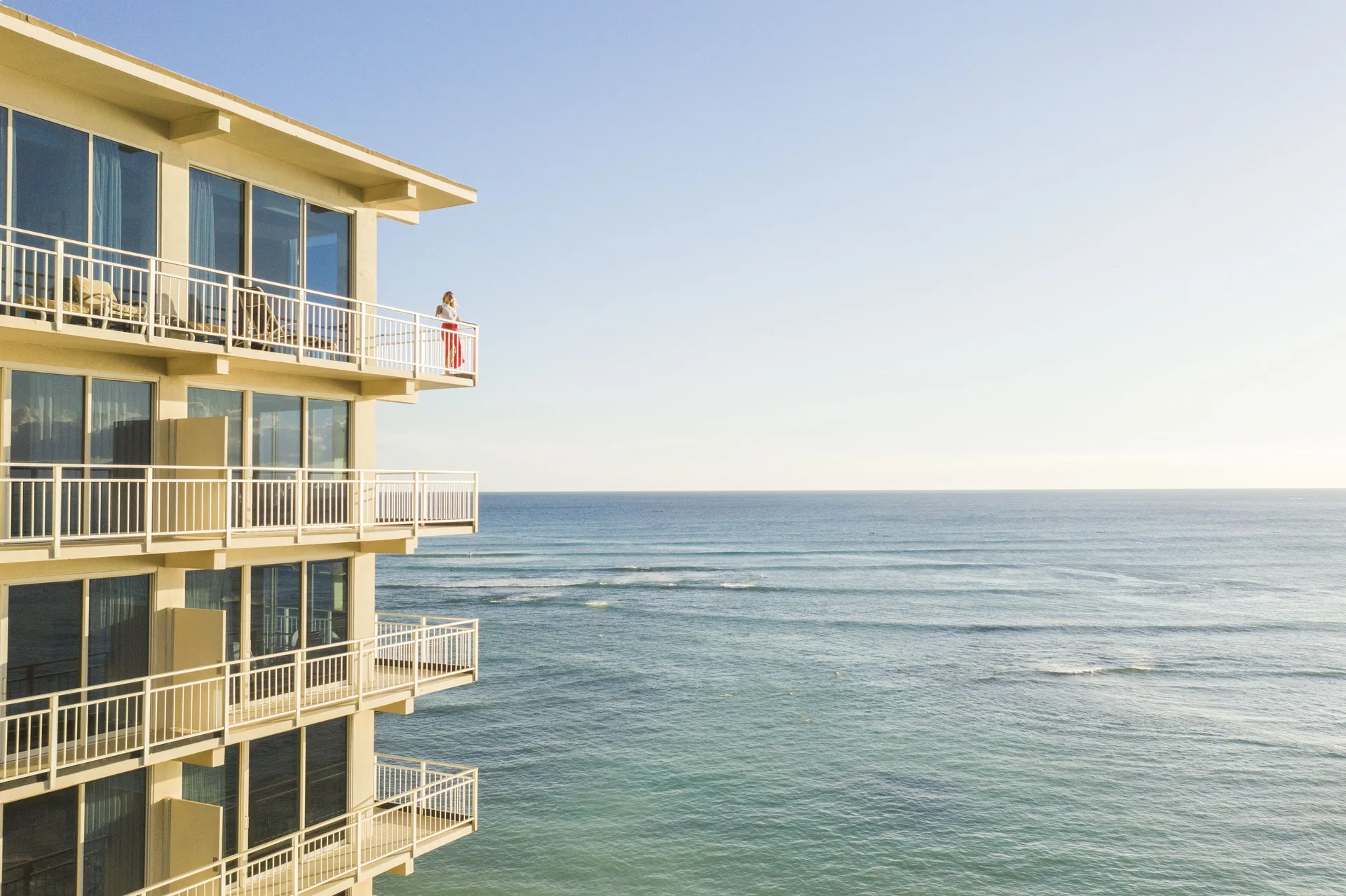 Ocean-facing balconies and calm blue water at Kaimana Beach Hotel.
