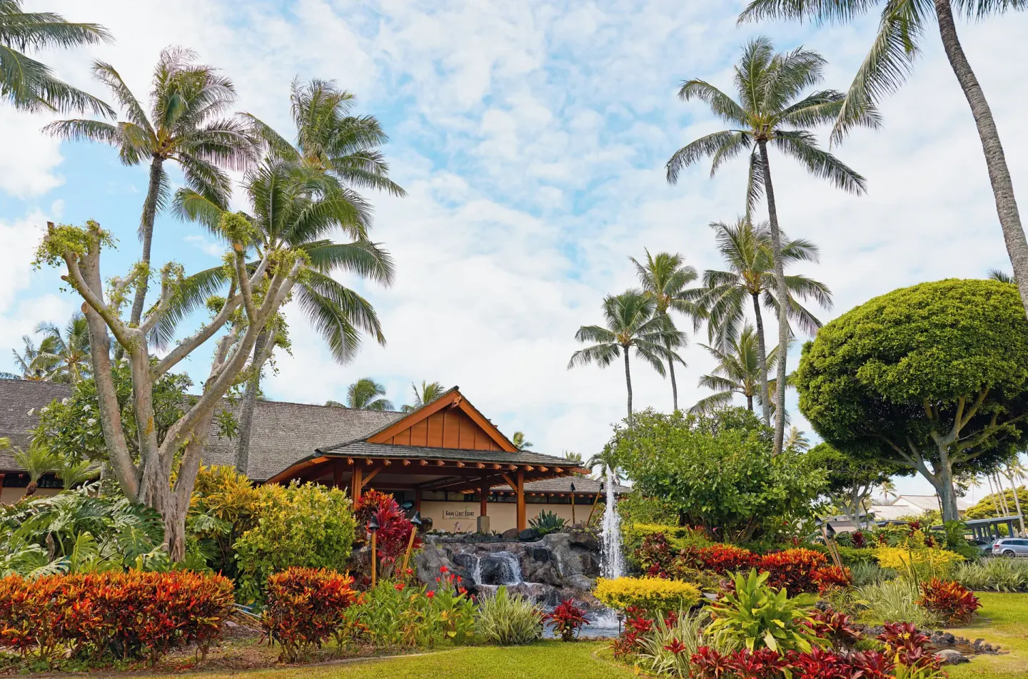 Tropical entrance landscaping and waterfall at Kauai Coast at the Beachboy.